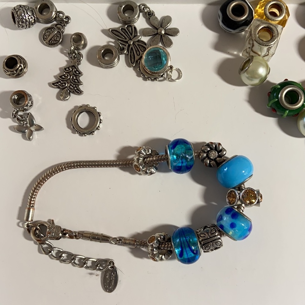 Charm bracelet with extra transferable beads and charms